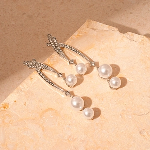 Elegant silver tassel earrings with crossed rhinestones and dangling white faux pearls
