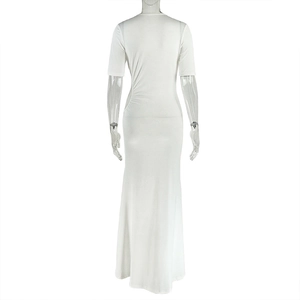 Rear view of white short-sleeved maxi dress featuring side pleats and slit detail