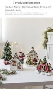 Close-up of lighted Christmas resin ornaments with mini house, tree and choir