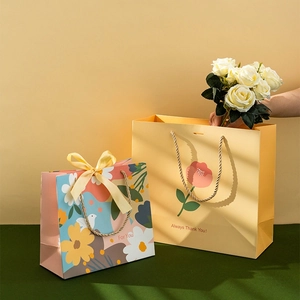 Minimalist floral gift bags with handles and ribbon for elegant present packaging
