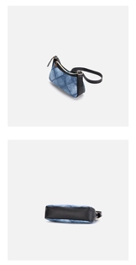 Detail of denim patchwork shoulder bag showing blue fabric textures and black leather base