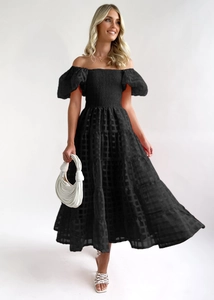 Detail of black off-the-shoulder midi dress featuring puff sleeves and textured plaid fabric