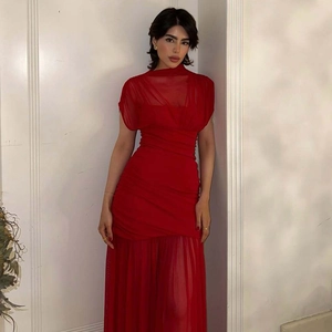 Detail view of the red bodycon dress featuring elegant mesh panels and ruched waist design