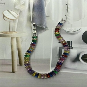Detailed macro view of silver rainbow tennis bracelet with colorful rectangular zircons
