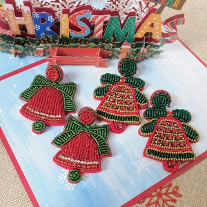 Detailed handmade beaded Christmas bell earrings with red green and gold crystals
