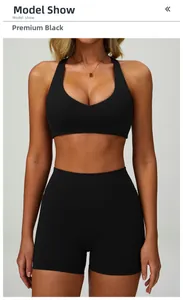Front model view of premium black racerback sports bra and high-waist fitness shorts