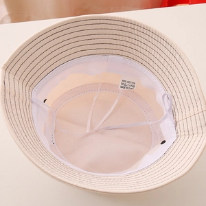 Detail of 100% cotton bucket hat interior showing breathable mesh sweatband and drawstring