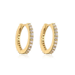Elegant gold hoop earrings with sparkling micro-pave crystals on white reflective surface