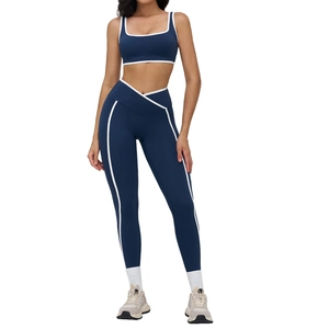 Navy blue yoga set with contrast white piping and crossover waist leggings for women