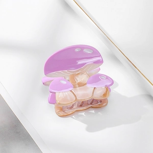 Cute mushroom shaped purple acetate hair claw clip with white dots and glossy finish