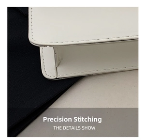 Close-up of precise stitching details on a white leather chain bag showing premium craftsmanship
