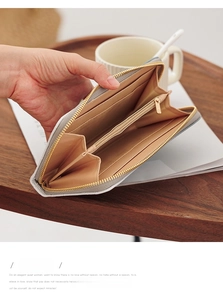 Detail view of the long gray wallet interior with multiple card slots and coin pocket