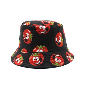 Reversible bucket hat with cartoon tomato print on black cotton fabric for sun protection