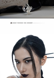 Close-up of silver irregular liquid metal texture ring with avant-garde fashion style