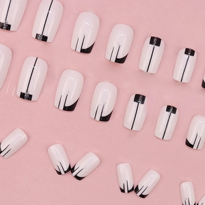 Short square press-on nails set featuring minimalist black and white geometric glitter art