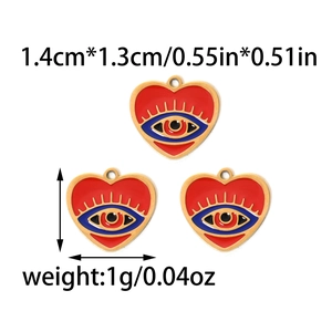 Detail view of heart evil eye pendants with dimensions 1.4cm by 1.3cm and weight info