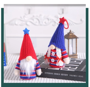 Detail view of Independence Day gnomes with plush hats and star accents on books