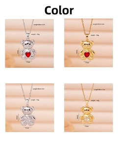 Detail of bear heart pendant necklaces in gold and silver with zircon stone settings
