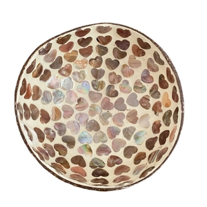 Artistic coconut shell bowl with heart-shaped shell inlay and iridescent finish