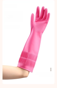 Detail of pink latex cleaning gloves with non-slip texture and long elbow-length cuffs