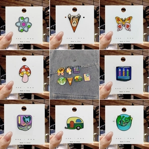Detailed grid of eco-friendly cartoon enamel pins featuring Earth and nature motifs