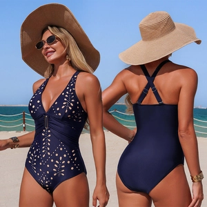 Navy blue one-piece swimsuit with V-neck laser cut floral patterns and cross-back straps