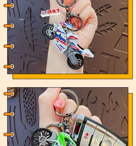 Detail showing cartoon motorcycle keychains with SPEED and POWER racing graphics
