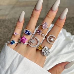 Close-up of S925 sterling silver rings with colorful heart and flower zircon gems