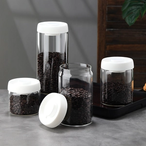 Set of 4 clear borosilicate glass vacuum sealed jars with white lids for coffee bean storage