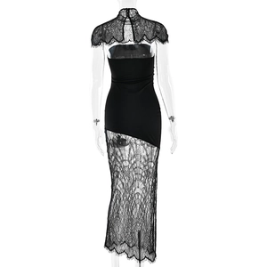 Detail view showing back of black lace shawl and sheer lace splicing on dress