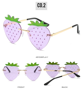 Three-way view showing front and side of purple strawberry shaped rimless sunglasses