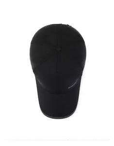 Top view of black quick-dry baseball cap featuring a white Sport logo on the side