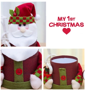 Detail of Santa Claus gift box showing knitted fabric texture and storage interior