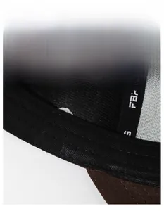 Close-up of the widened black sweatband inside the embroidered baseball cap