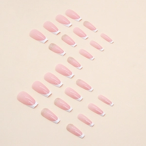 Long ballet press-on nails with pink base, white French tips and glitter accents