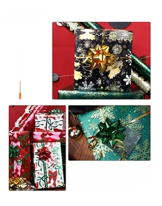 Macro shot of assorted Christmas gift wrapping paper rolls with festive snowflake and bow patterns