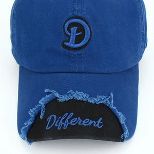 Detail of navy cotton baseball cap featuring 3D embroidered D logo and distressed brim