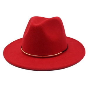 Detail of red wool fedora hat featuring a gold metal ring and black cord accent