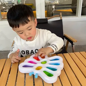 Detail of butterfly sensory toy with colorful numbered pop bubbles for early learning