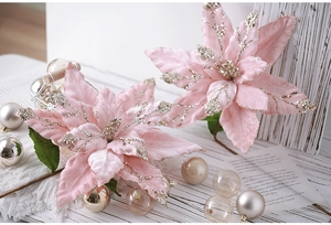 Close-up of pink Christmas poinsettia with silver glitter edges for tree decoration