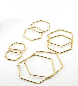 Detail view of four sizes of hexagonal gold stainless steel hoop earrings for women