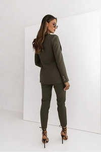 Detail view of the back and tailored fit of olive green double-breasted suit set