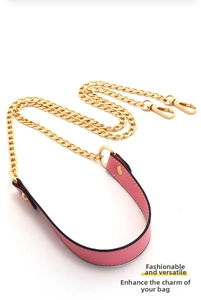 Detailed view of pink PU leather shoulder strap with gold metal chain and lobster clasps