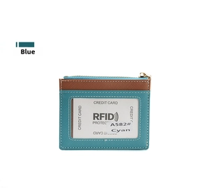 Detail of RFID blocking credit card holder in cyan Saffiano leather with clear ID window