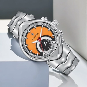Macro shot of Y2K style silver watch with orange dial and unique wavy metal strap detail