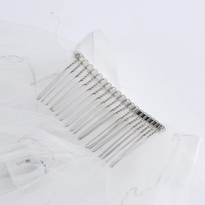 Luminous bridal veil with white mesh and silver metal hair comb for wedding photography