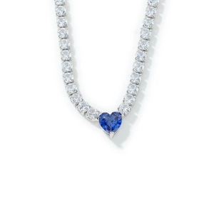 Elegant silver tennis necklace featuring a blue heart-shaped crystal and zircon stones