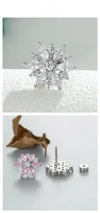 Detail showing snowflake stud earrings with marquise zircon and screw back closures