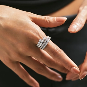 Luxurious layered s925 silver ring featuring full sparkling zircon crystals on model's hand