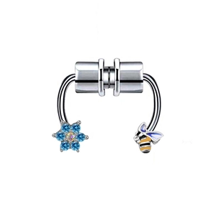 Close-up of magnetic septum ring with blue rhinestone flower and enamel bee detail